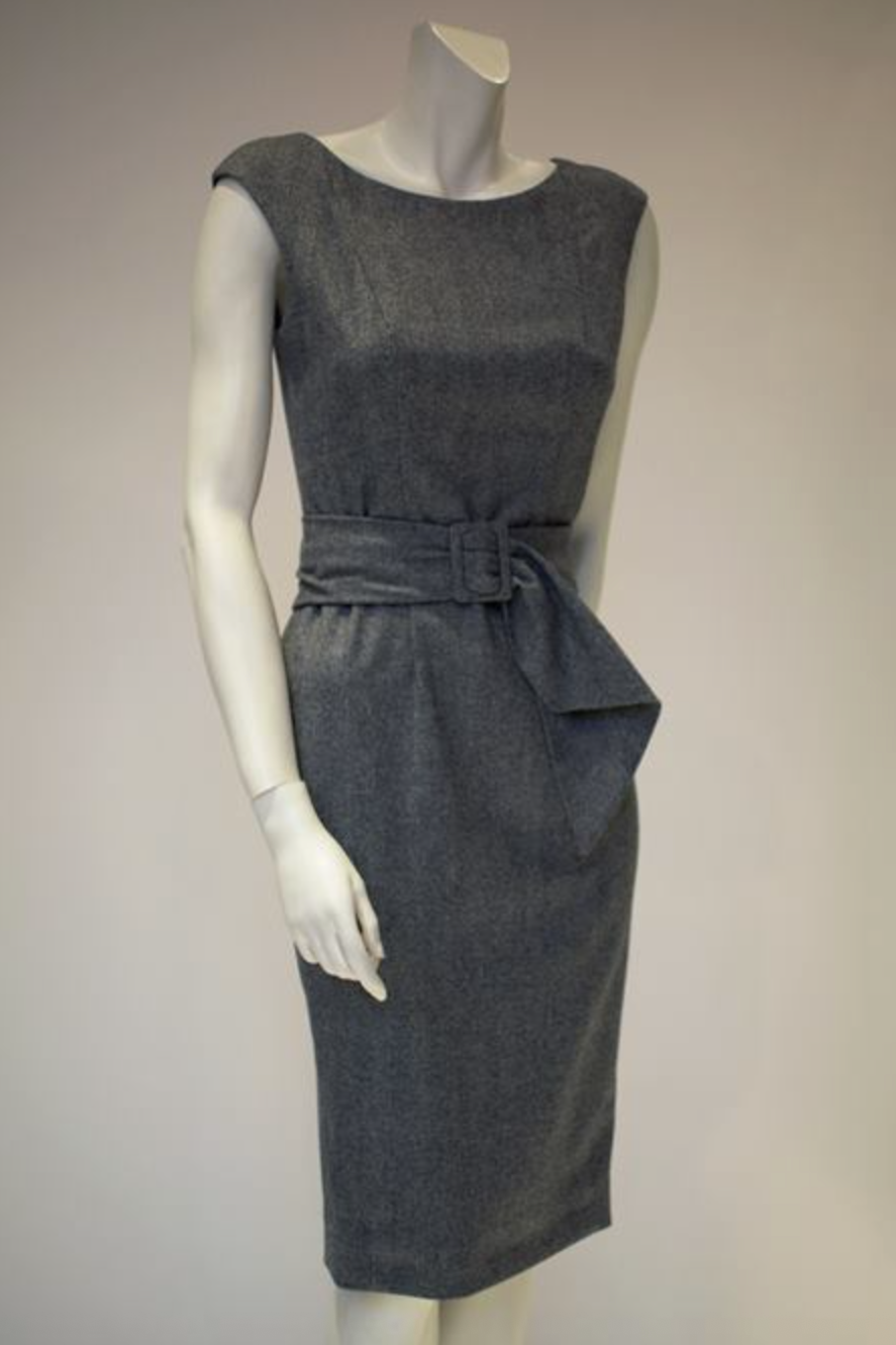 Grey herringbone wool cashmere shift dress on a mannequin with matching waterfall belt
