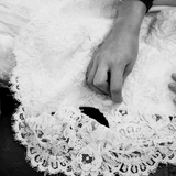 Bridal lace veil being sewn